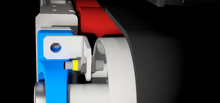 Drehzahlüberwachung mit induktivem Sensor an der Umlenktrommel am Dosierband